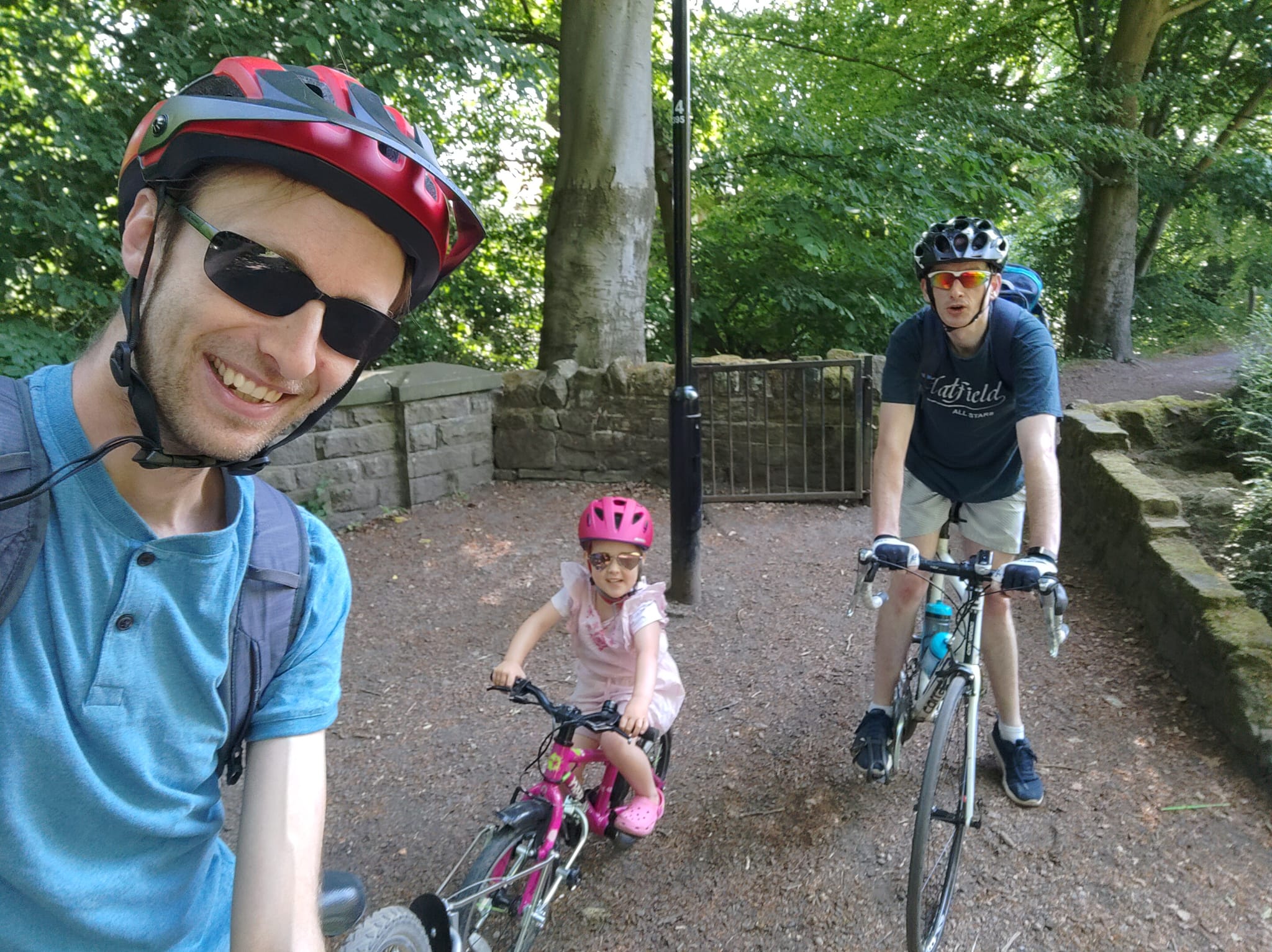 Myself and daughter on followme tandem, friend on road cycle